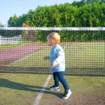 Load image into Gallery viewer, toddler on a tennis court wearing a smiley jacquard sweater and navy legging

