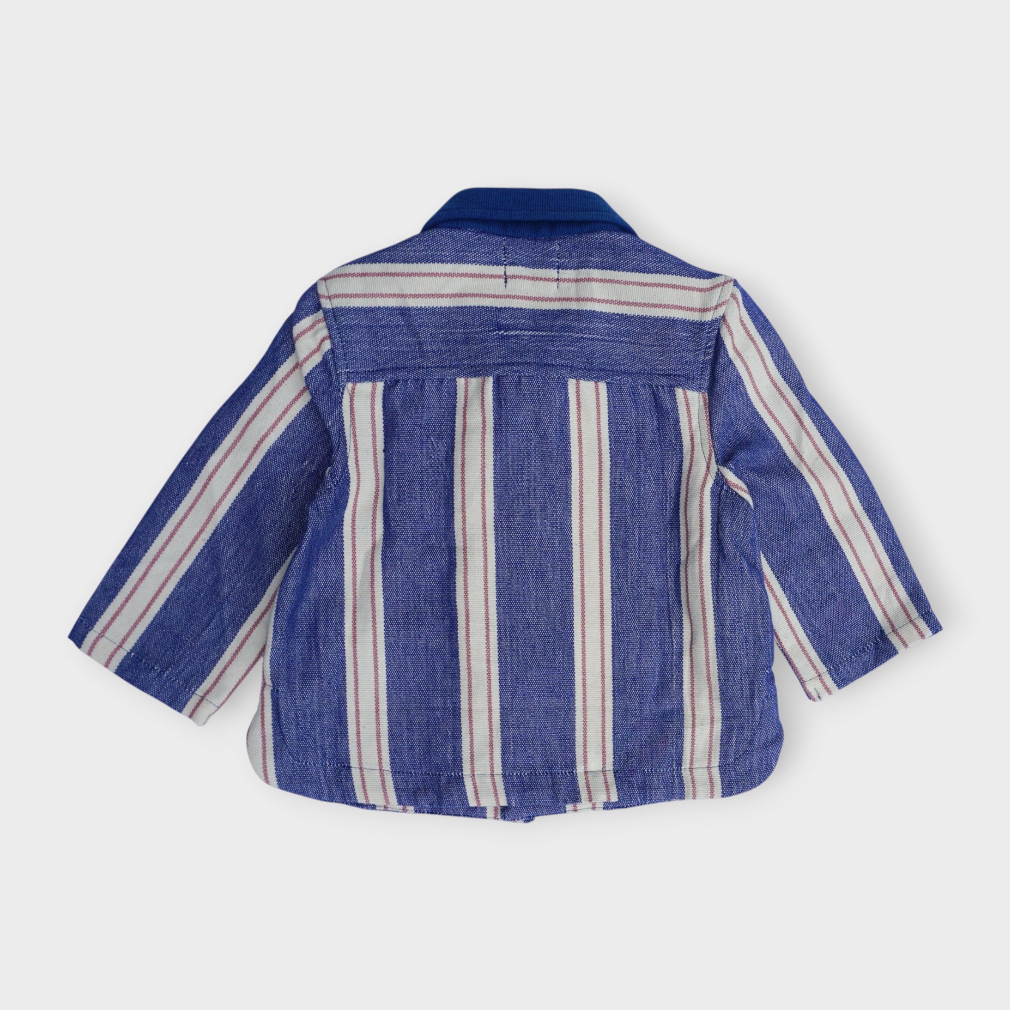 Organic cotton kids chore jacket in indigo blue umbrella stripe with antique brass snaps and patch pockets, by League of Friends
