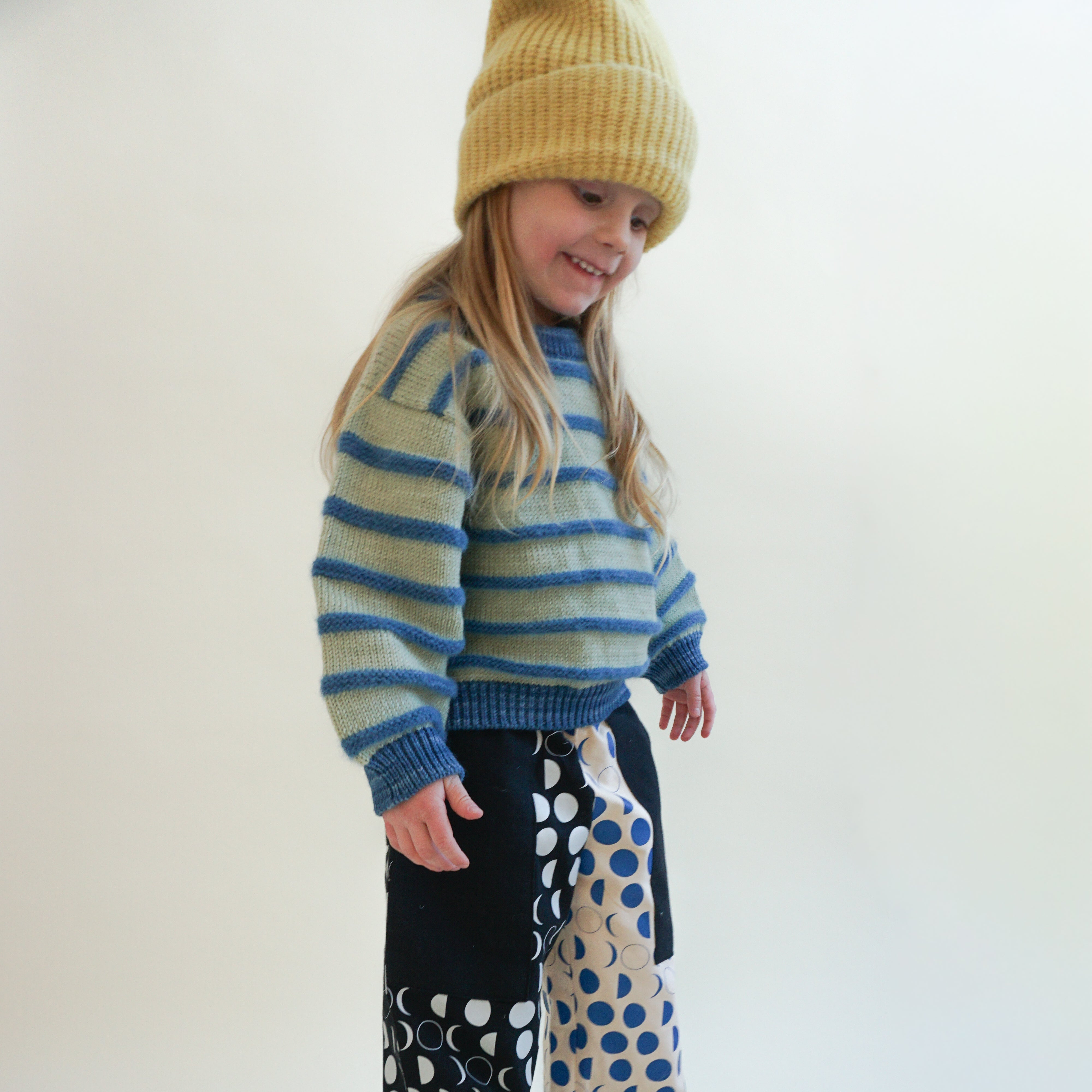 Fuzzy striped kids crewneck sweater styled with printed wide-leg pants — naturally dyed baby alpaca, merino wool, mulberry silk and mohair — League of Friends