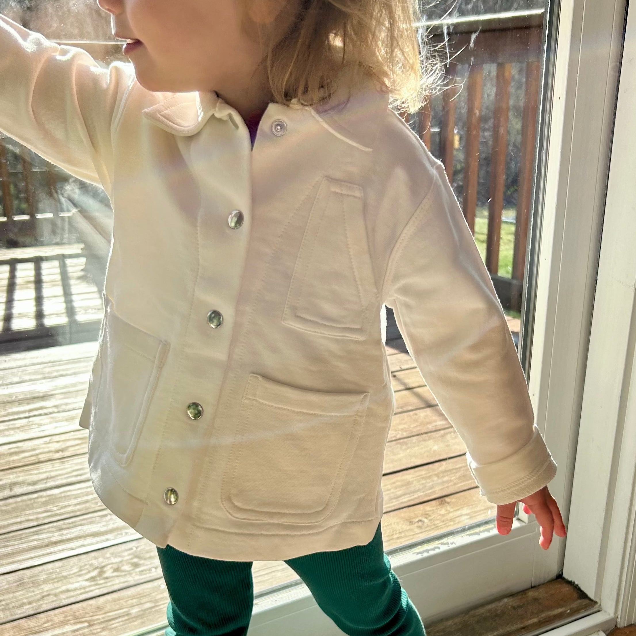 toddler wearing white jacket