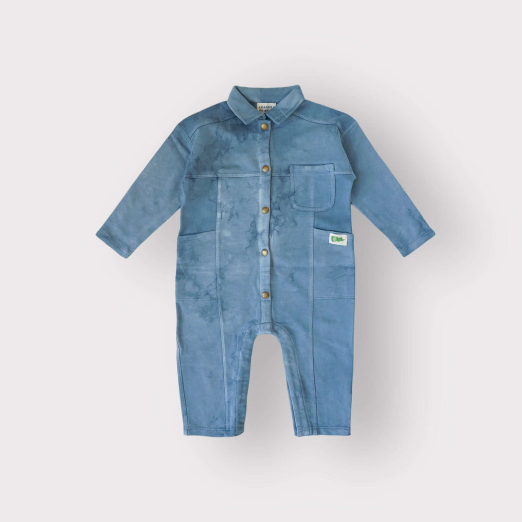 flat view of indigo dyed boiler suit with snap front