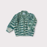 Load image into Gallery viewer, Green and Ivory marbled v-neck sweater laying flat
