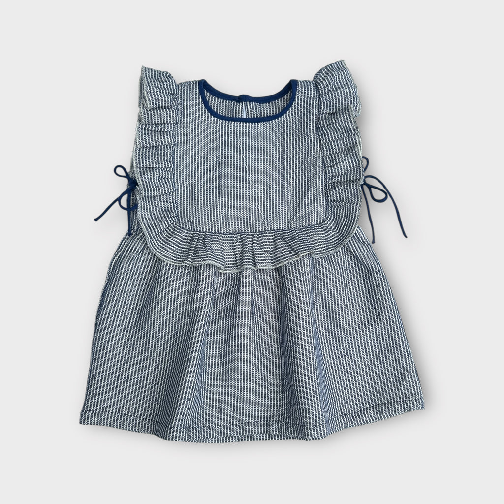 Blue and white striped dress with ruffled details on a white background