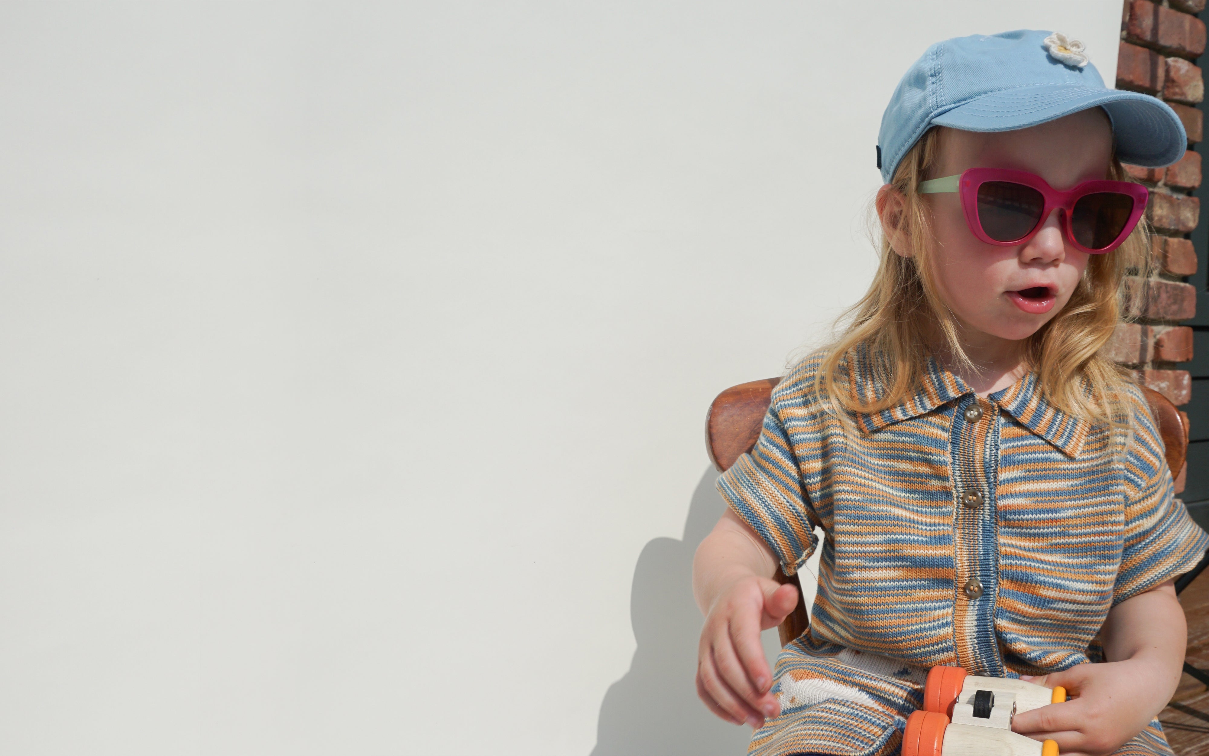 toddler in tie dye organic cotton jumpsuit one piece
