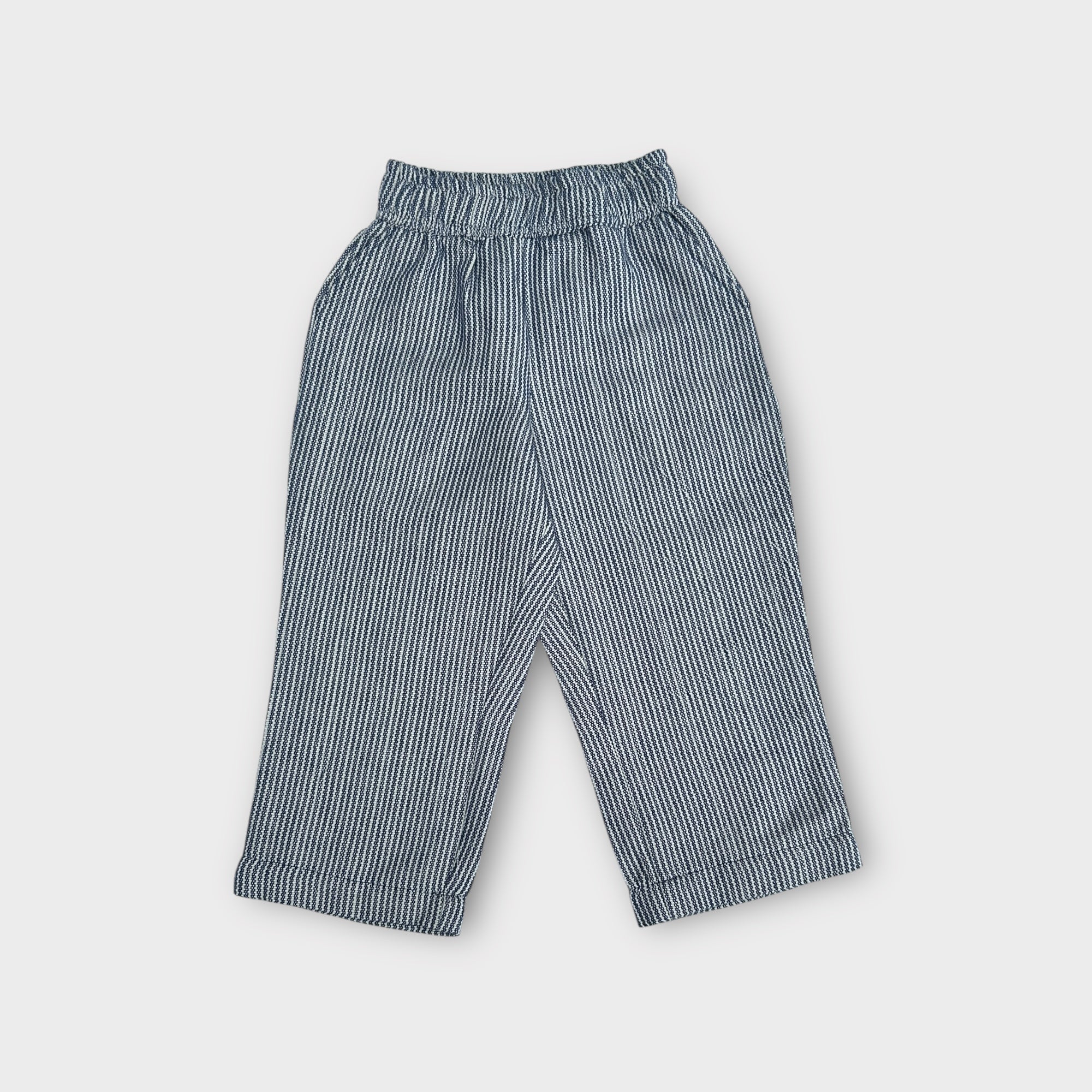 Striped pants on a light gray background